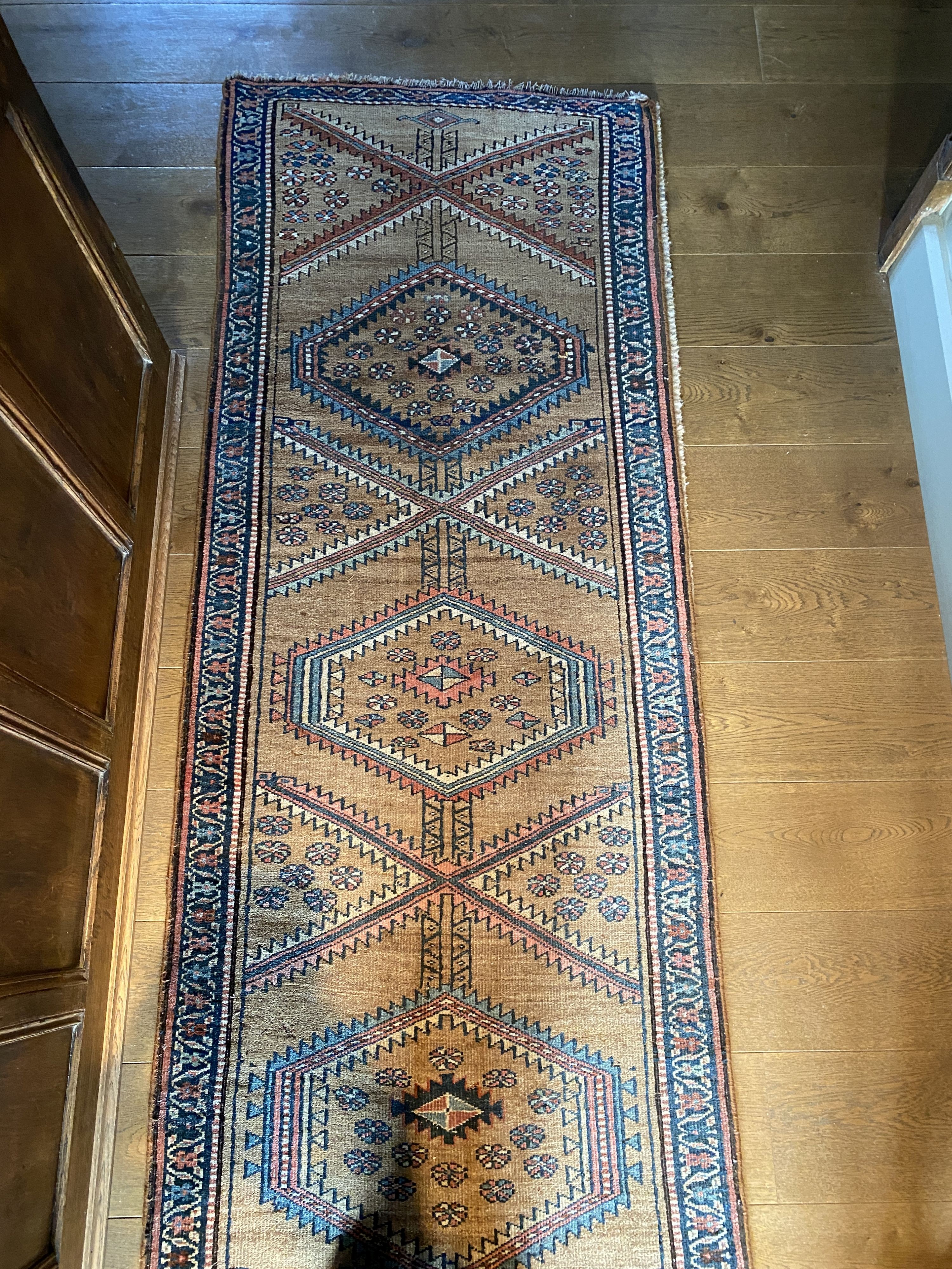 A Caucasian style pale brown ground runner, with hexagonal motifs, 382 x 77cm